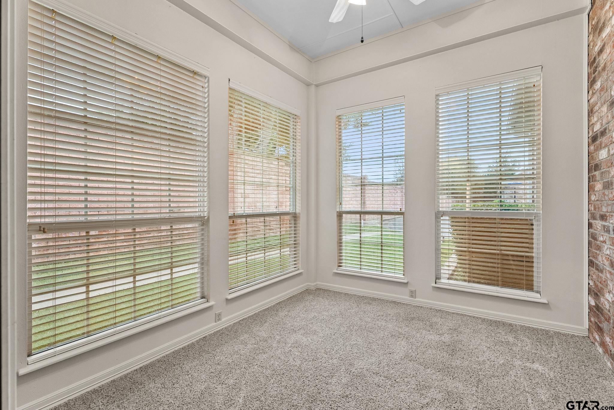 2438 Dietz Lane Tyler, TX 75701 - Photo 7 of 26 a view of an empty room with a balcony