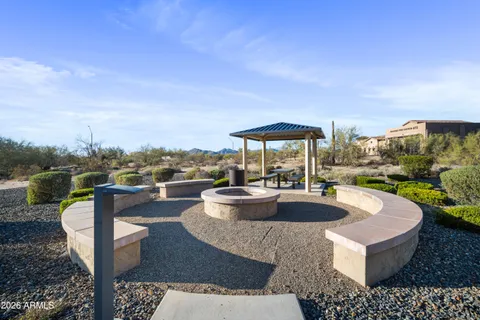 a swimming pool with outdoor seating and city view