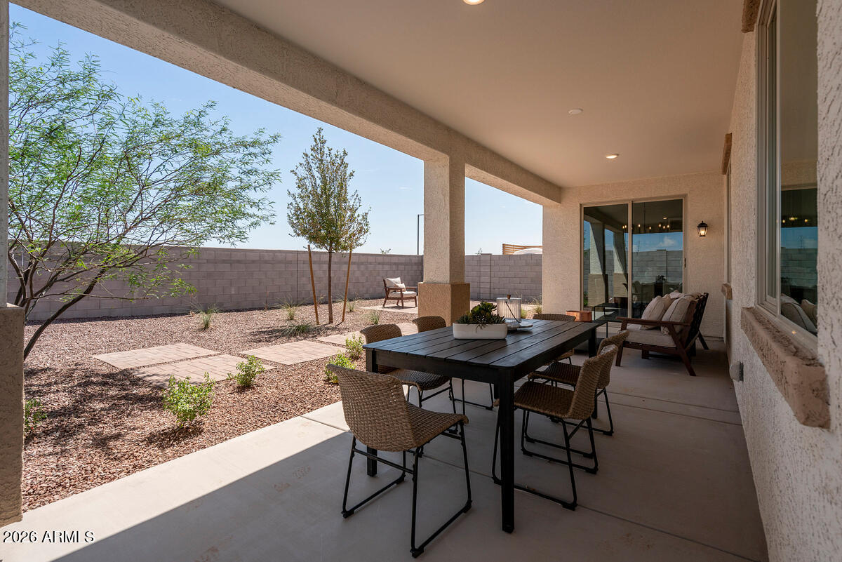 17547 West Fulton Street Goodyear, AZ 85338 - Photo 10 of 10 a view of a dining table and chairs in the patio