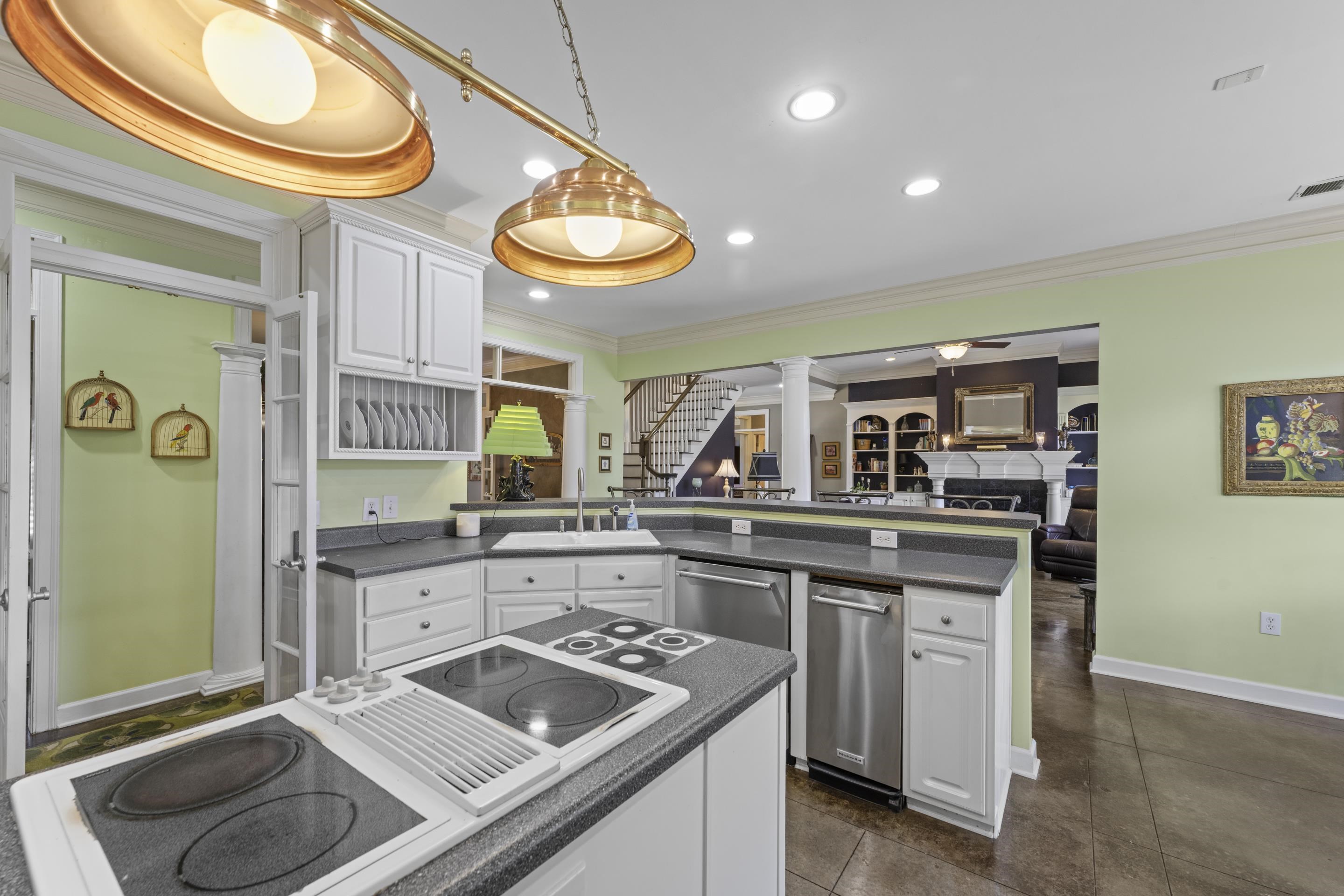 4132 Blackheath Drive Bartlett, TN 38135 - Photo 11 of 40 a kitchen with a sink cabinets and wooden floor