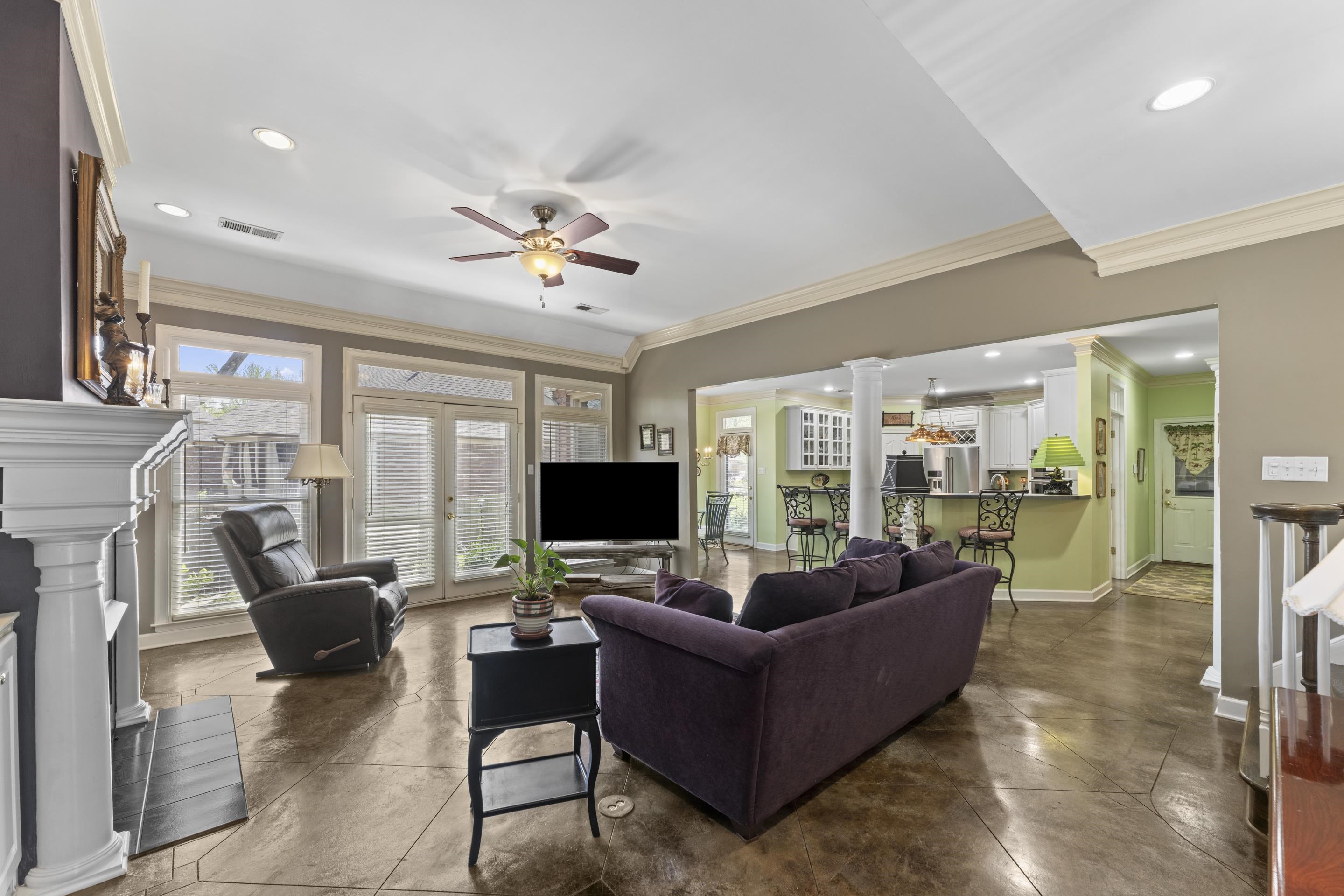 4132 Blackheath Drive Bartlett, TN 38135 - Photo 15 of 40 a living room with furniture a fireplace and a flat screen tv