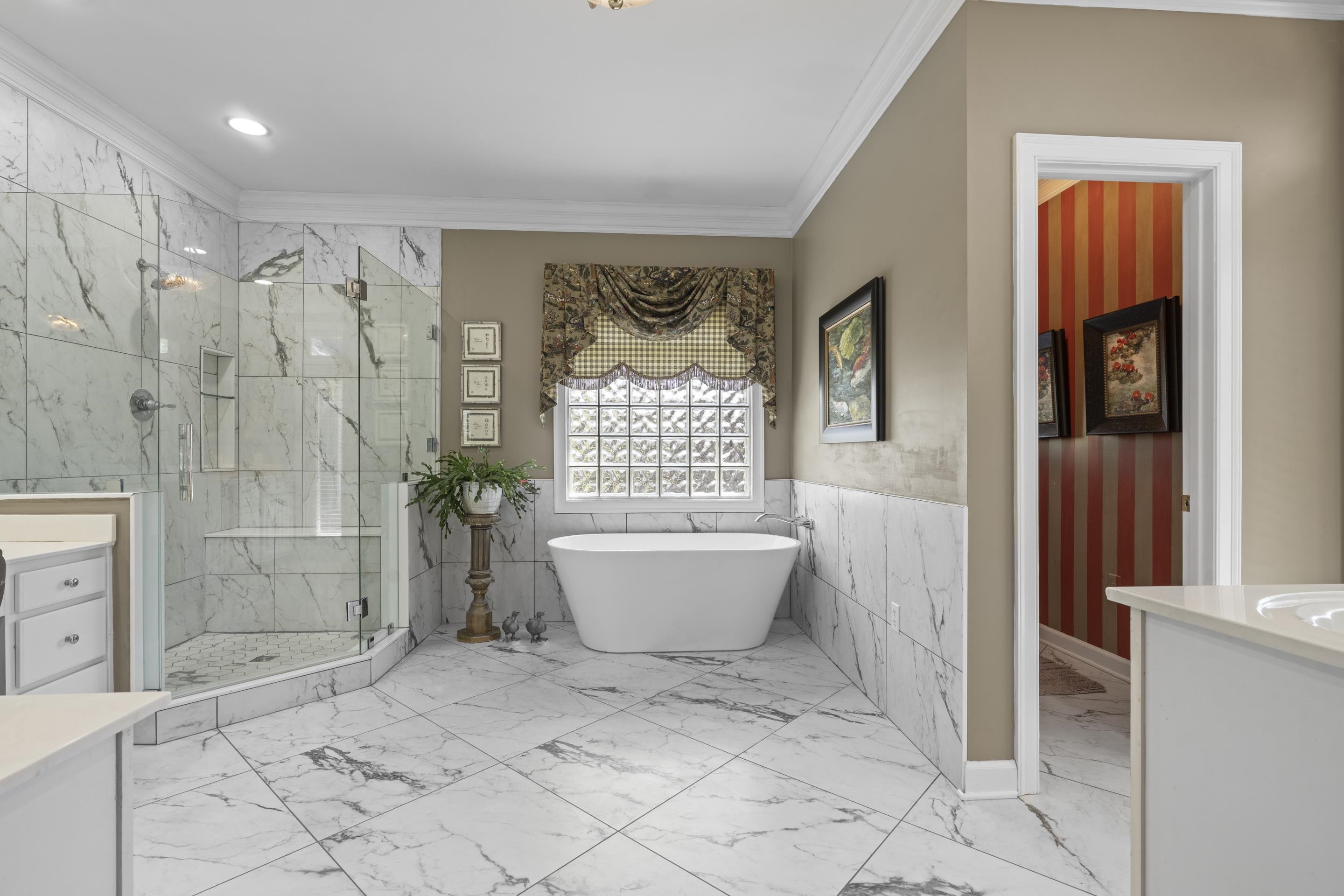 4132 Blackheath Drive Bartlett, TN 38135 - Photo 18 of 40 a bathroom with a bathtub and shower