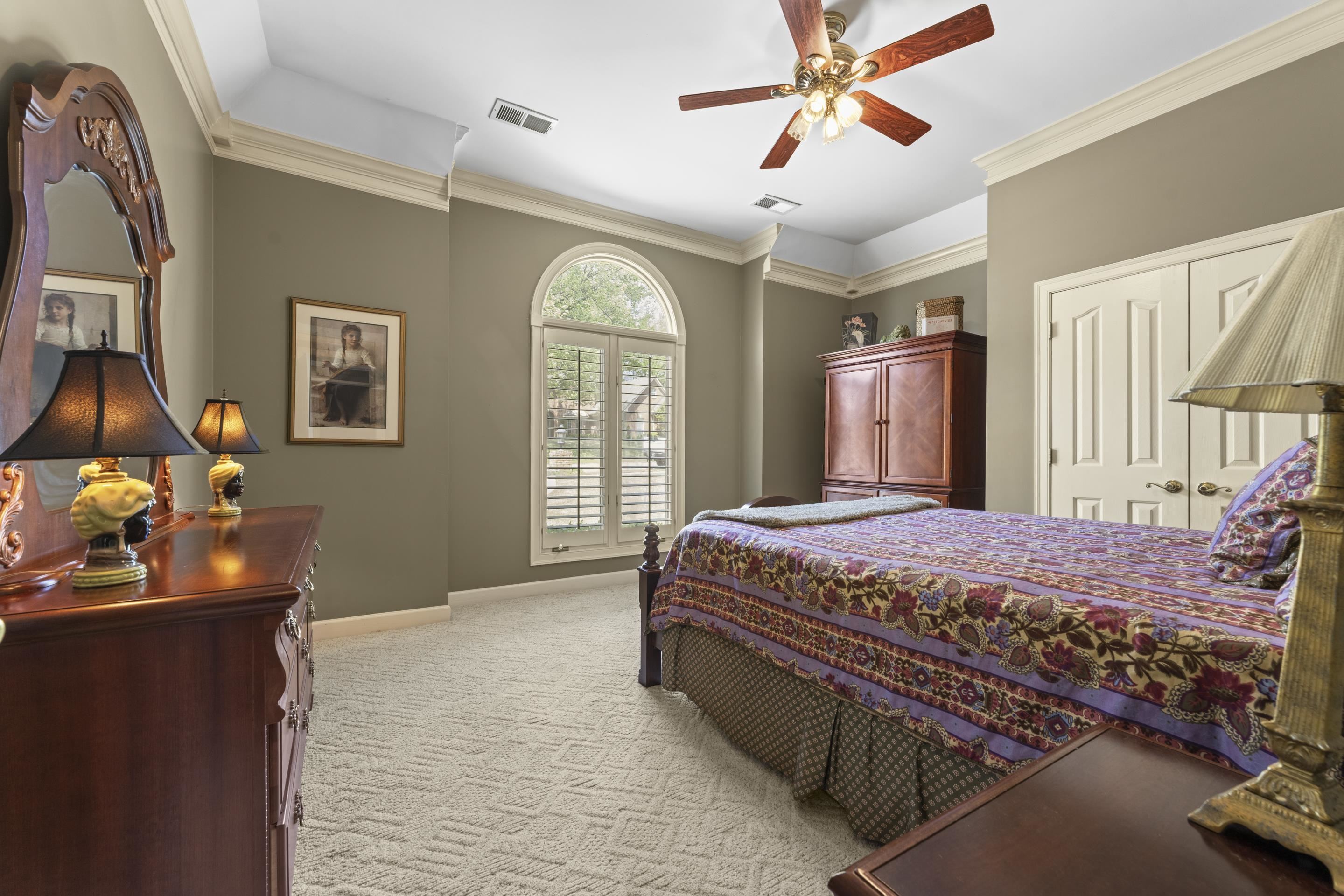 4132 Blackheath Drive Bartlett, TN 38135 - Photo 24 of 40 a bedroom with a bed and a chandelier
