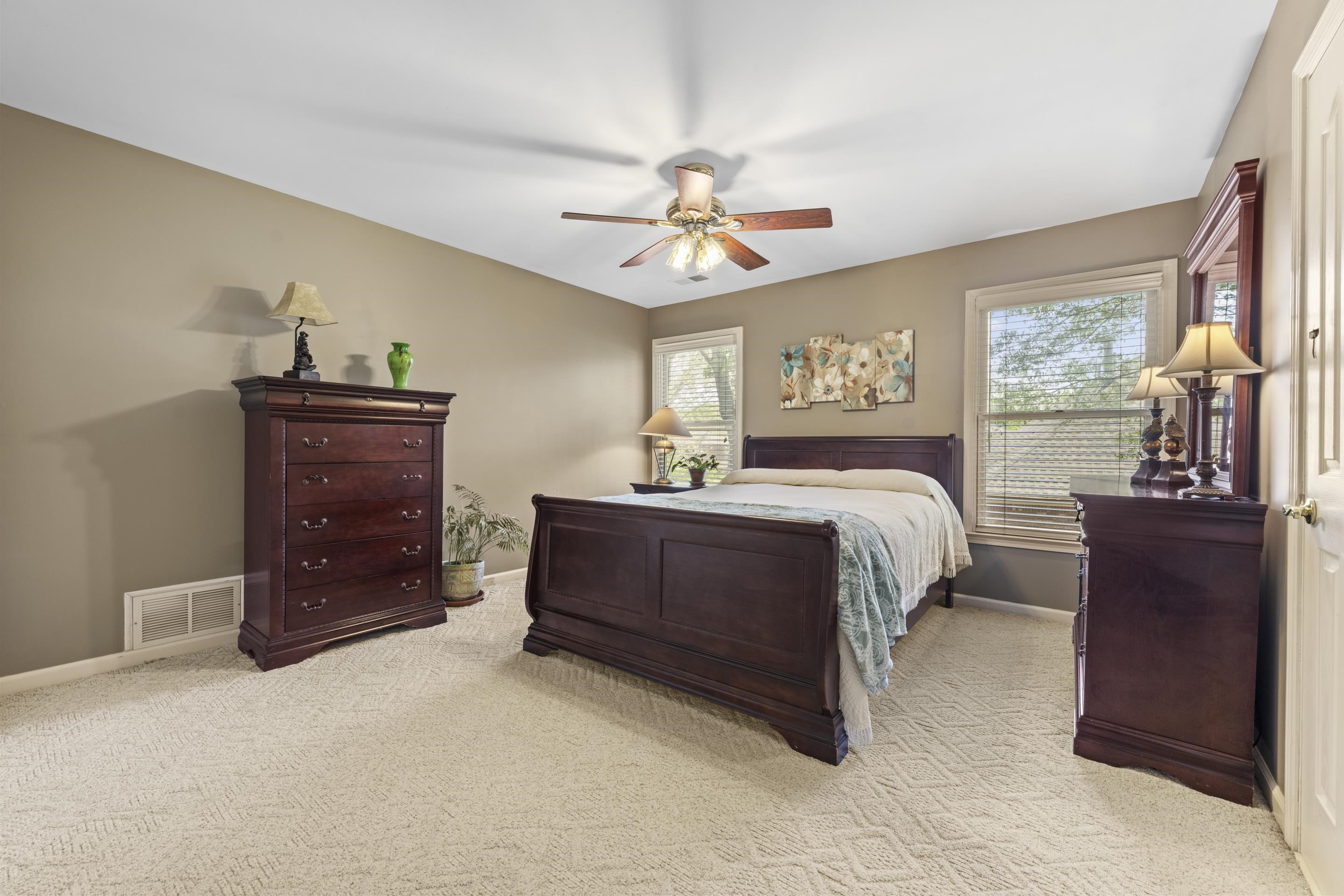 4132 Blackheath Drive Bartlett, TN 38135 - Photo 26 of 40 a bedroom with a bed and wooden floor