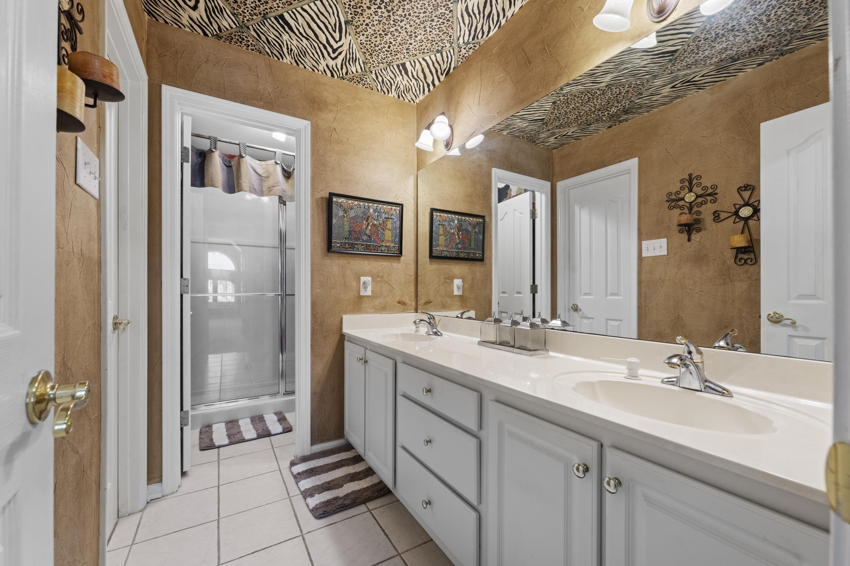 4132 Blackheath Drive Bartlett, TN 38135 - Photo 29 of 40 a spacious bathroom with a double vanity sink a mirror and a shower