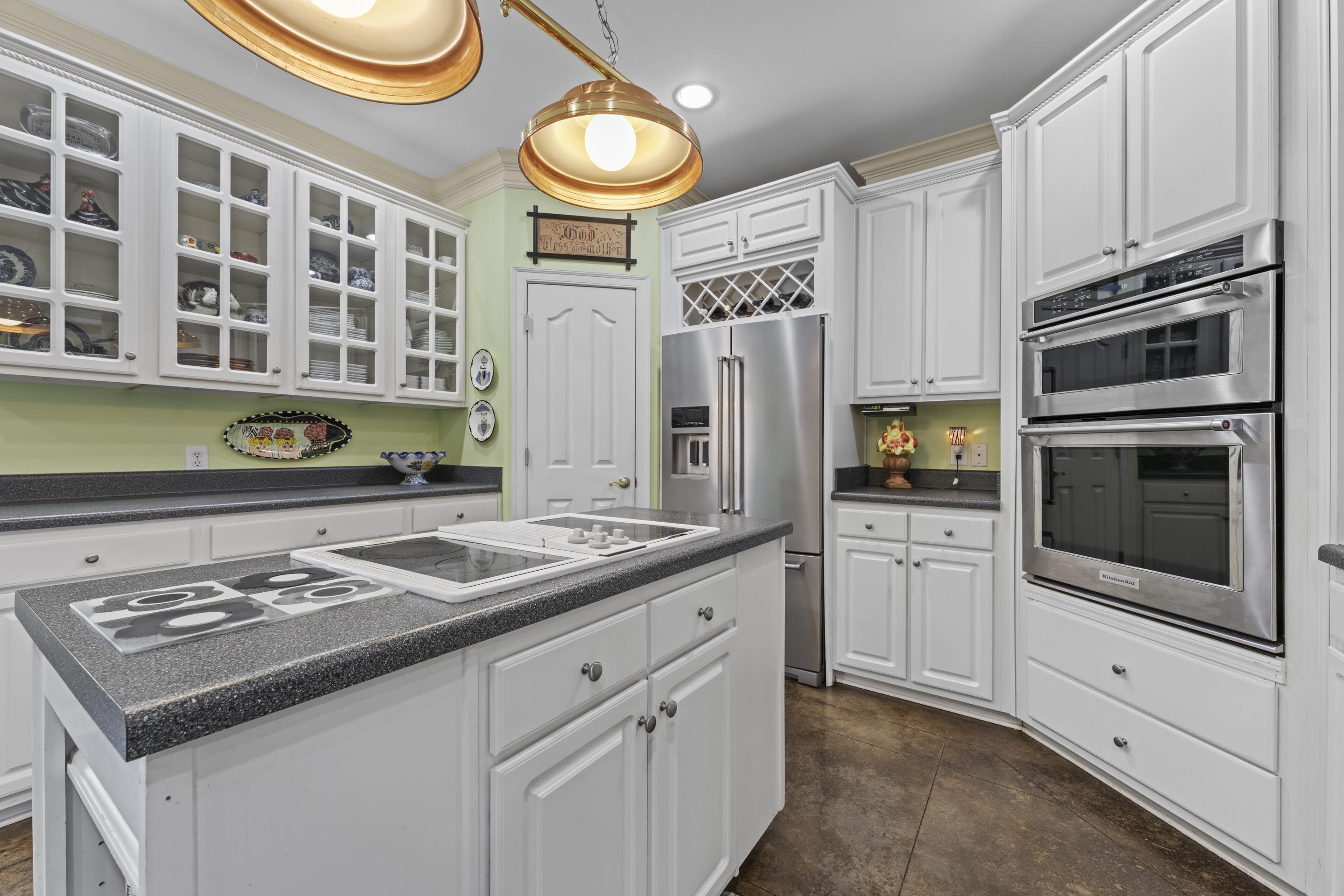 4132 Blackheath Drive Bartlett, TN 38135 - Photo 10 of 40 a kitchen with stainless steel appliances a stove a sink and a microwave