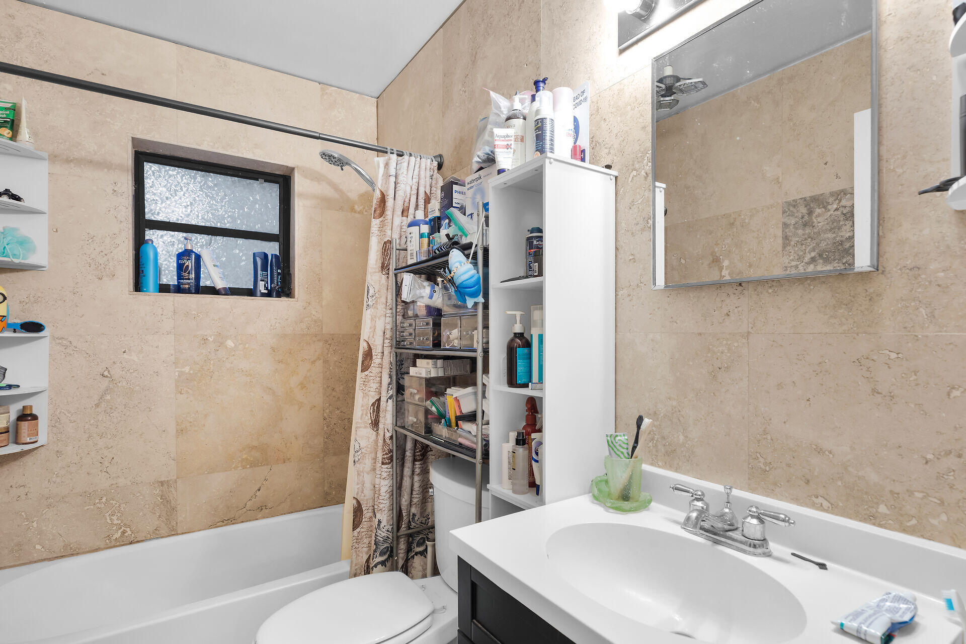 14 Miami Drive Key Largo, FL 33037 - Photo 9 of 16 a bathroom with a sink toilet and shower