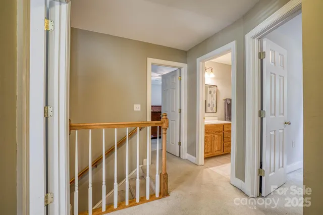 a spacious bathroom with a double vanity sink toilet and a mirror
