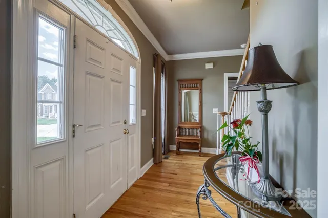 a view of a hallway and wooden floor an entryway