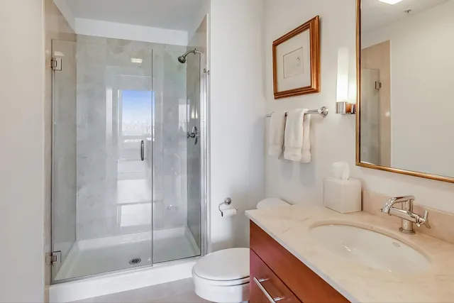 a view of a livingroom with furniture and mirror