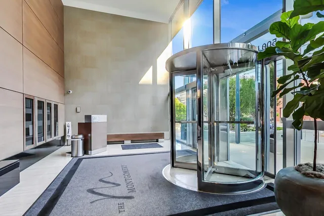 a kitchen with stainless steel appliances kitchen island granite countertop a sink a stove and white cabinets