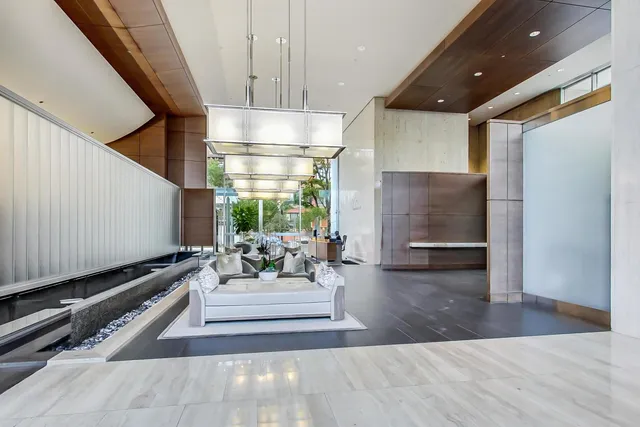 a view of a patio with dining table and chairs and plants