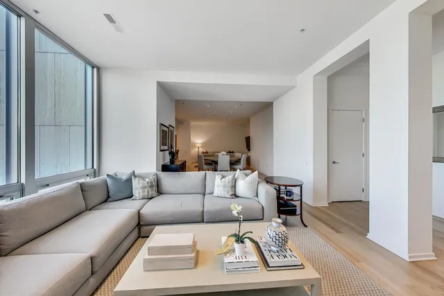 a living room with furniture and a rug