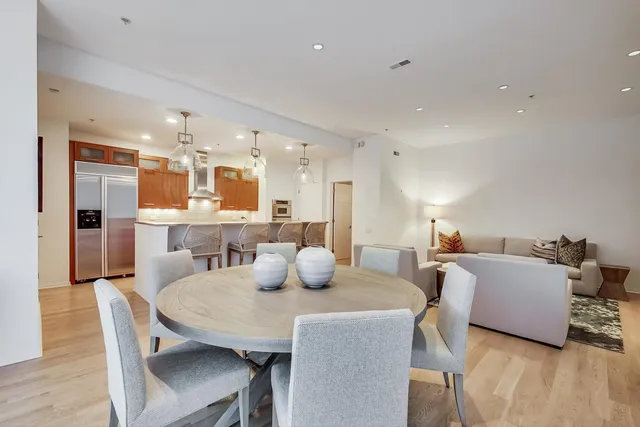 a dining room with furniture and wooden floor