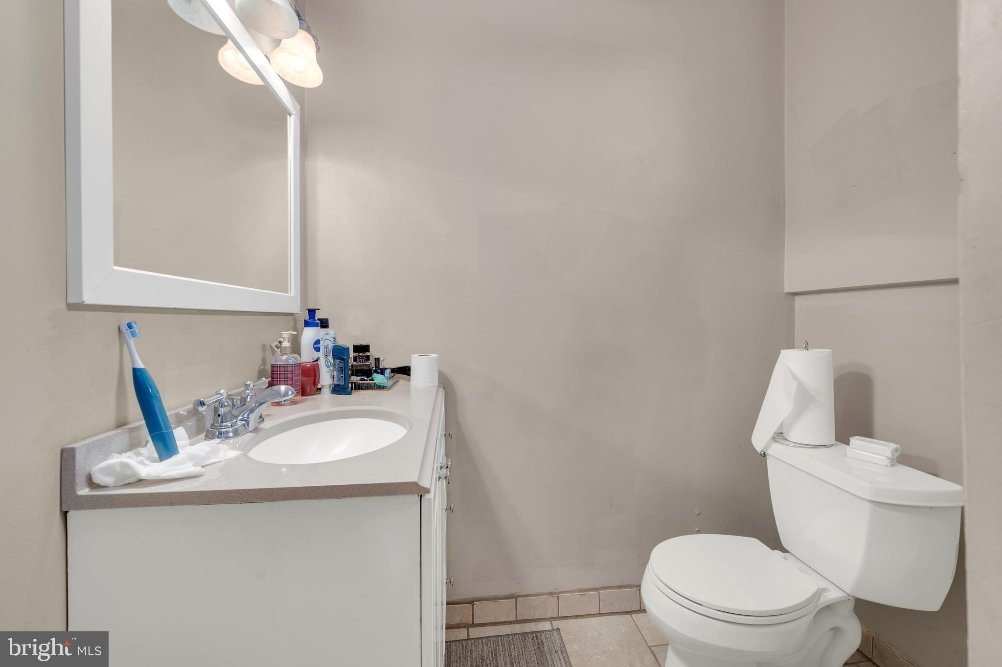 121 Bridgeboro Street Riverside, NJ 08075 - Photo 23 of 34 a bathroom with a sink toilet and mirror