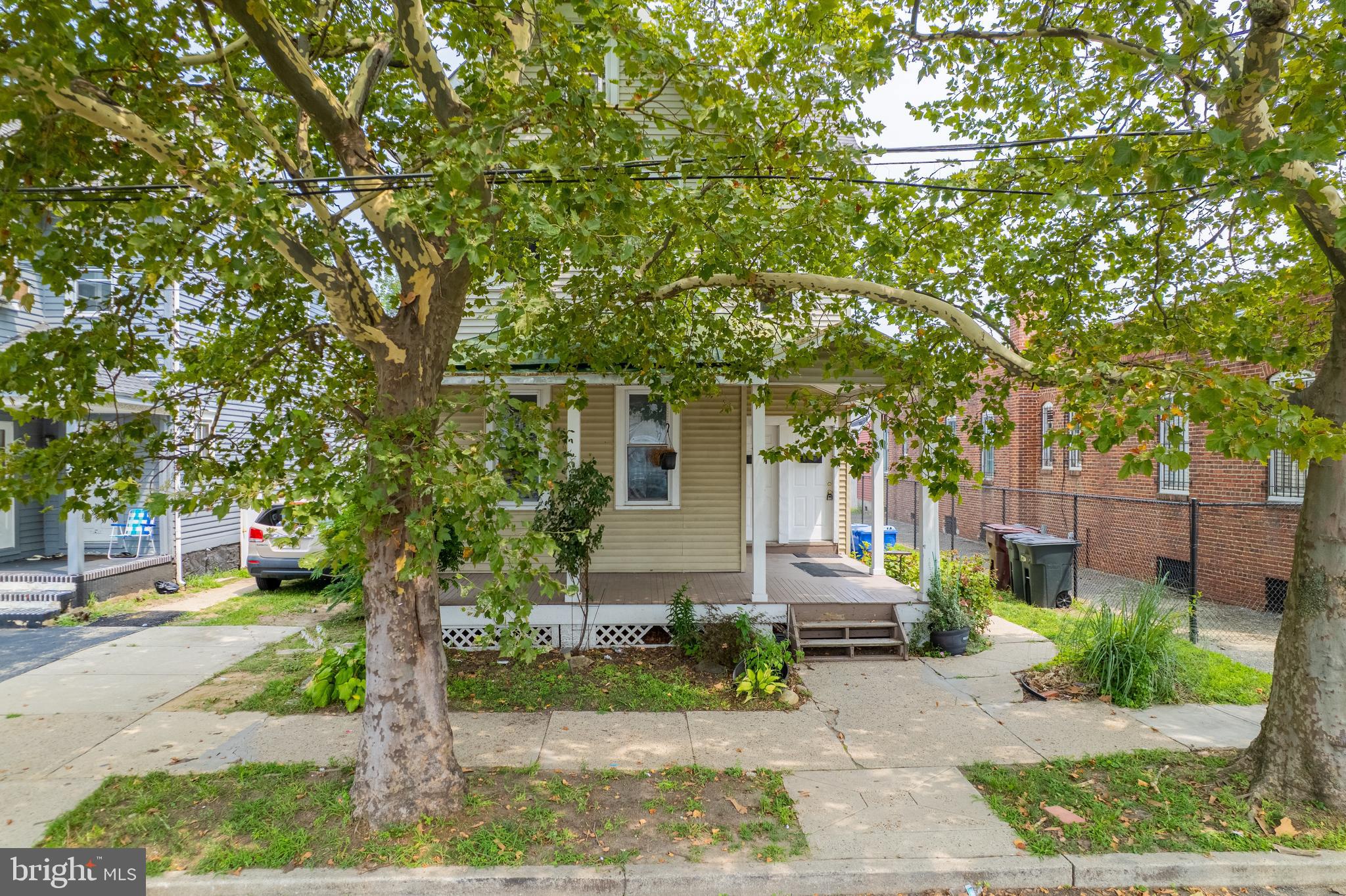 121 Bridgeboro Street Riverside, NJ 08075 - Photo 26 of 34 a front view of a house with a garden