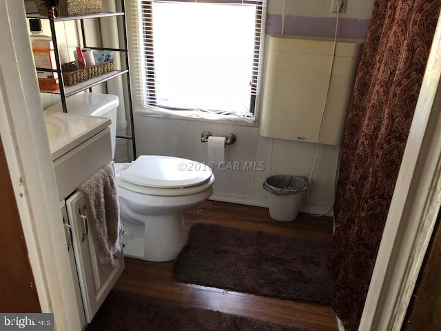 7713 Libertytown Road Berlin, MD 21811 - Photo 6 of 14 a bathroom with a sink and a toilet