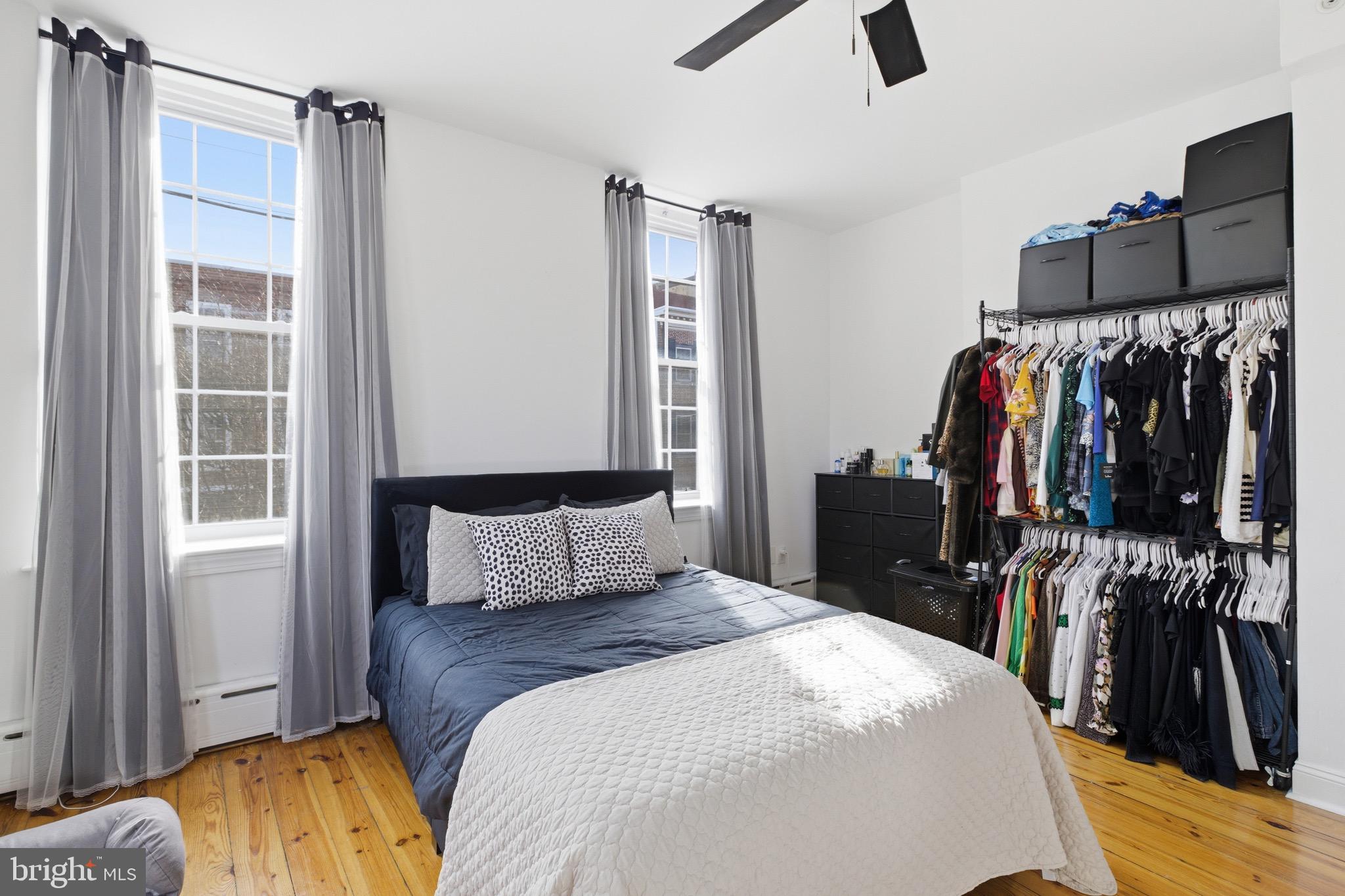 700 South 2nd Street, Unit B1 Philadelphia, PA 19147 - Photo 12 of 18 a bedroom with a bed and a walk in closet