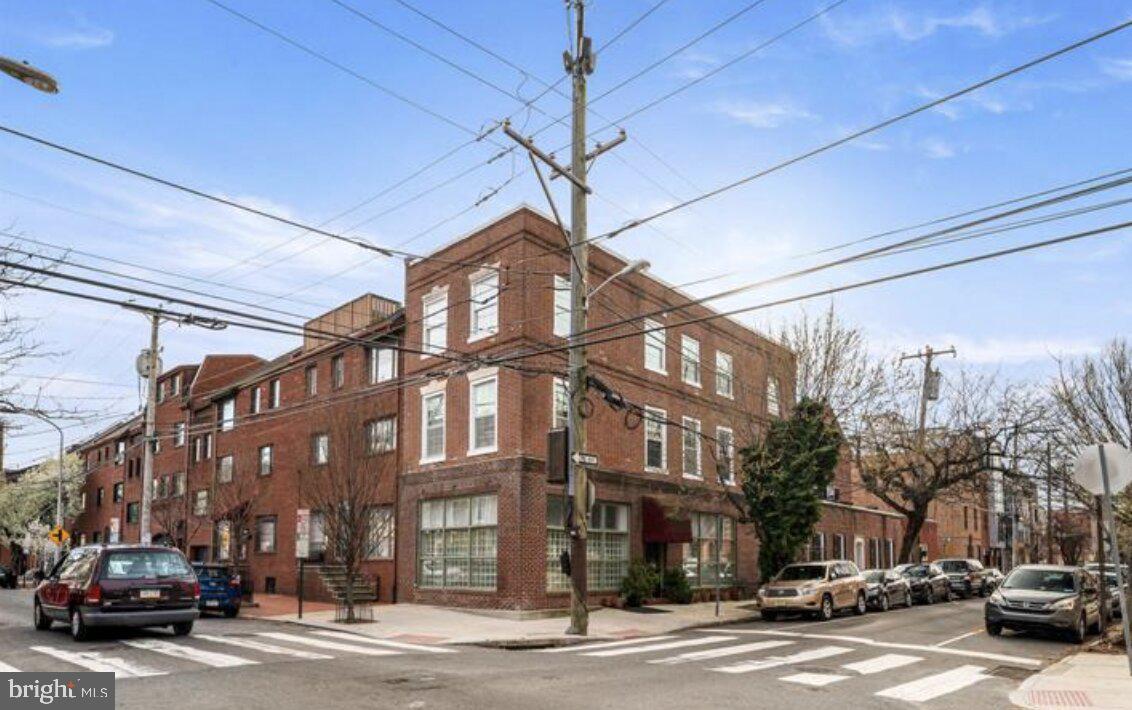 700 South 2nd Street, Unit B1 Philadelphia, PA 19147 - Photo 18 of 18 a city street lined with parked cars and buildings