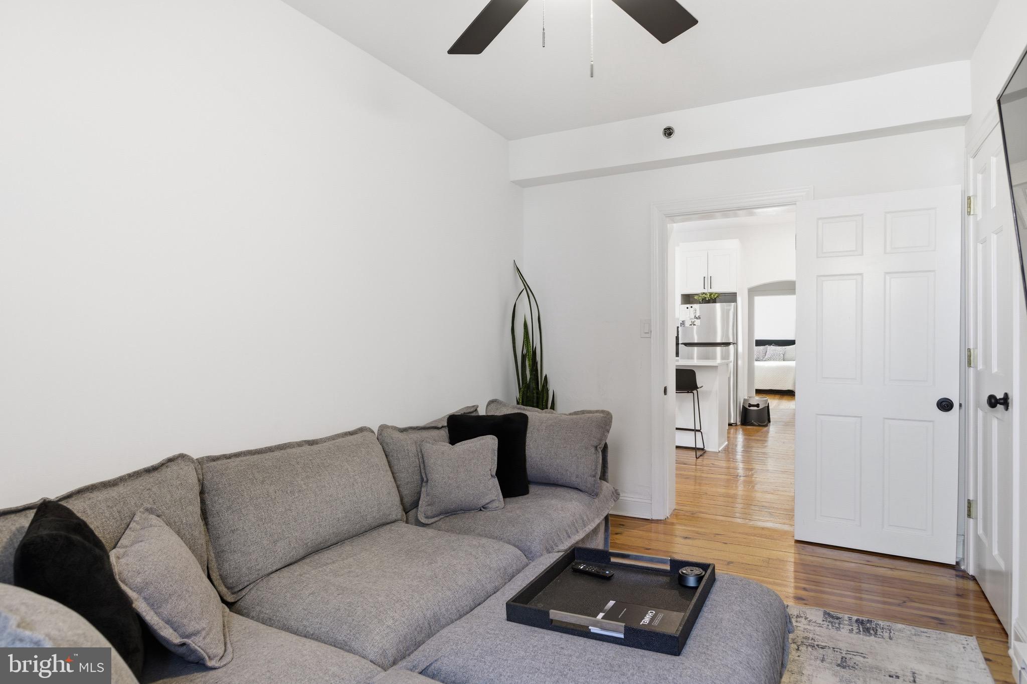 700 South 2nd Street, Unit B1 Philadelphia, PA 19147 - Photo 8 of 18 a living room with furniture and wooden floor