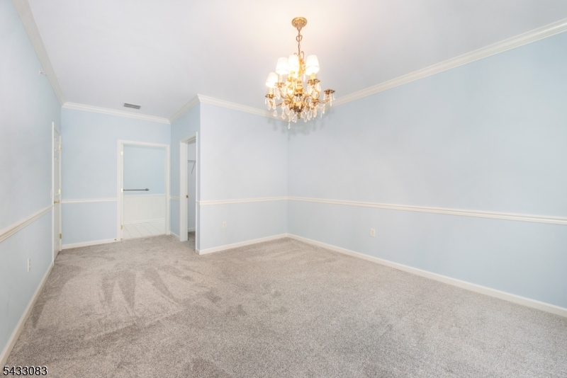 29 Ridgeview Lane, Unit 29 Mount Arlington, NJ 07856 - Photo 20 of 39 a view of an empty room with chandelier fan
