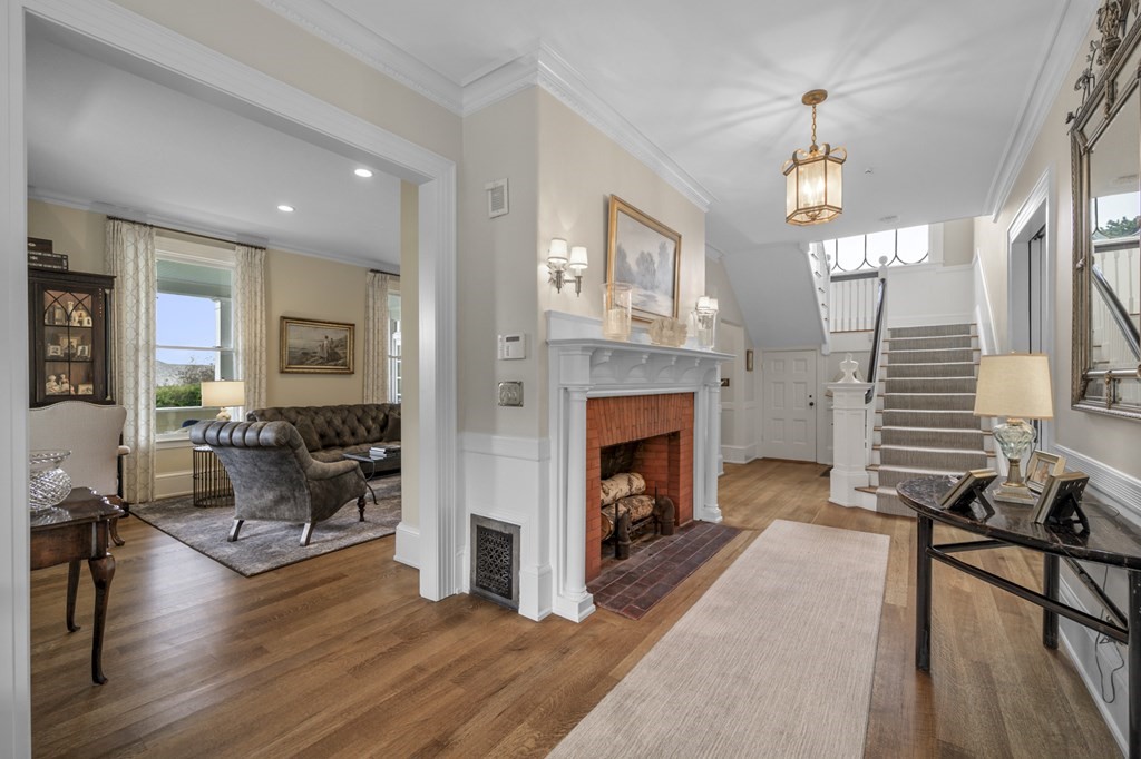346 Ocean Avenue Marblehead, MA 01945 - Photo 12 of 42 a living room with furniture and a fireplace
