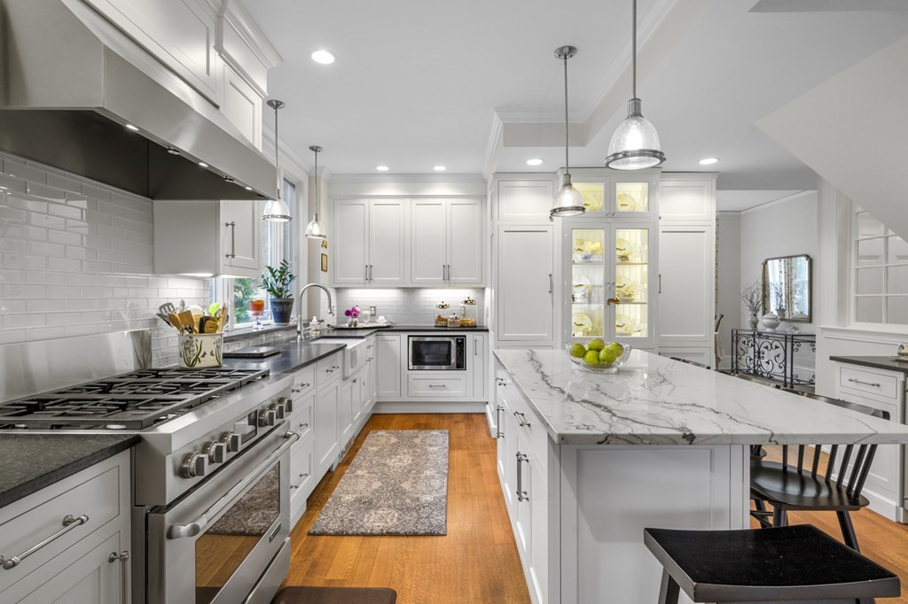 346 Ocean Avenue Marblehead, MA 01945 - Photo 21 of 42 a kitchen with granite countertop a stove a sink a refrigerator and a dining table