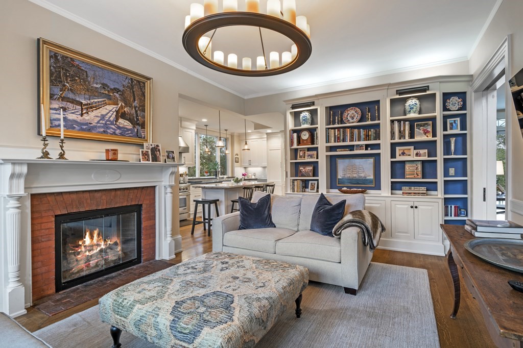 346 Ocean Avenue Marblehead, MA 01945 - Photo 24 of 42 a living room with furniture a fireplace and a bookshelf