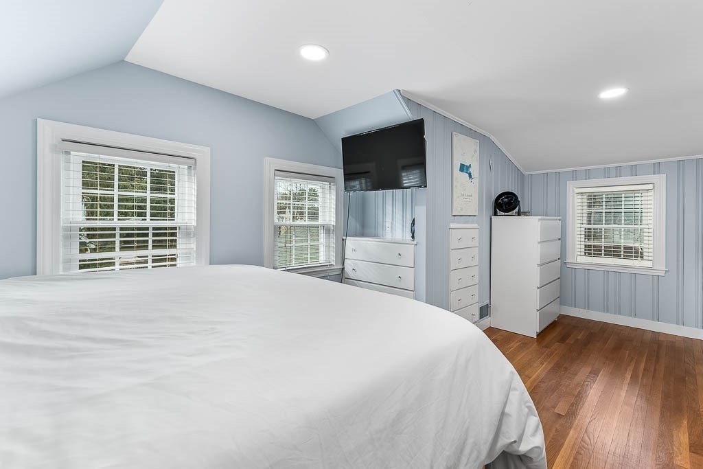 61 Ledgewood Road Dedham, MA 02026 - Photo 24 of 41 a spacious bedroom with a large bed and a window
