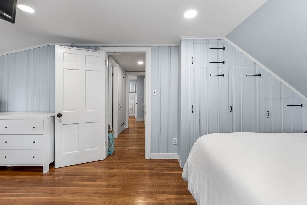 61 Ledgewood Road Dedham, MA 02026 - Photo 25 of 41 a spacious bedroom with a bed and wooden floor