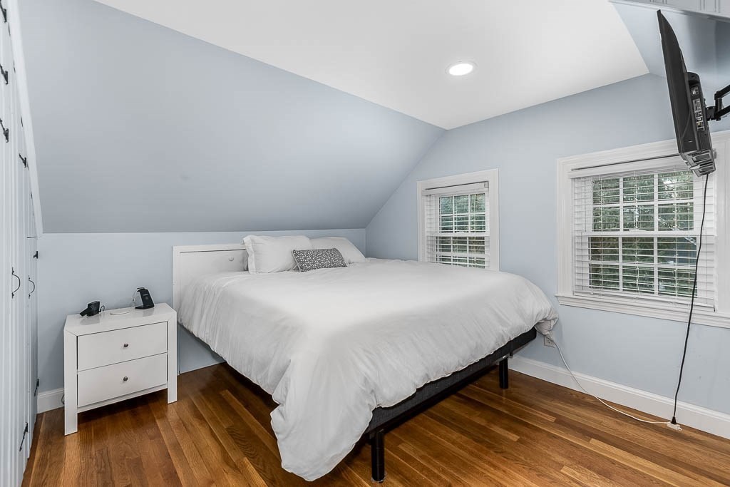 61 Ledgewood Road Dedham, MA 02026 - Photo 26 of 41 a bedroom with a bed and wooden floor