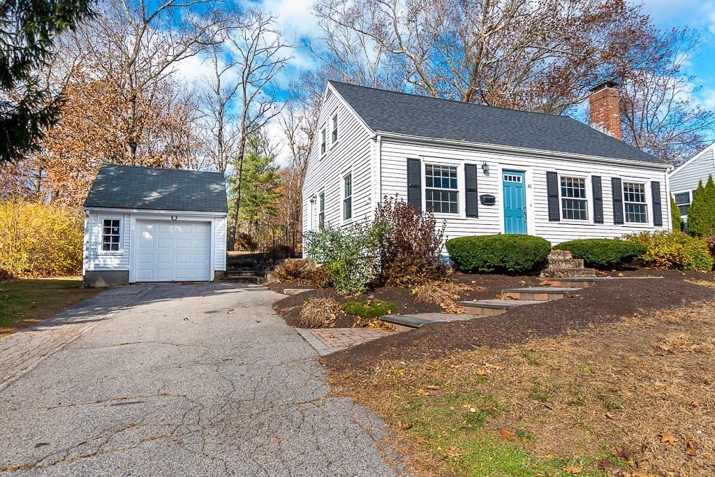 61 Ledgewood Road Dedham, MA 02026 - Photo 3 of 41 a front view of a house with a yard and potted plants