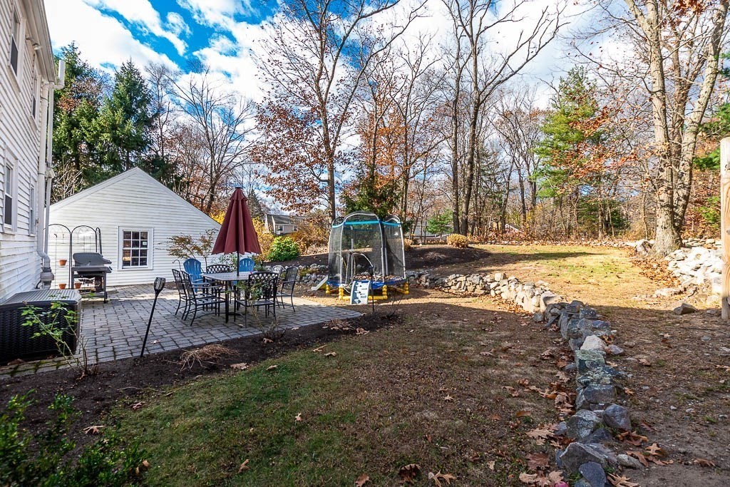 61 Ledgewood Road Dedham, MA 02026 - Photo 31 of 41 a view of a house with backyard and sitting area