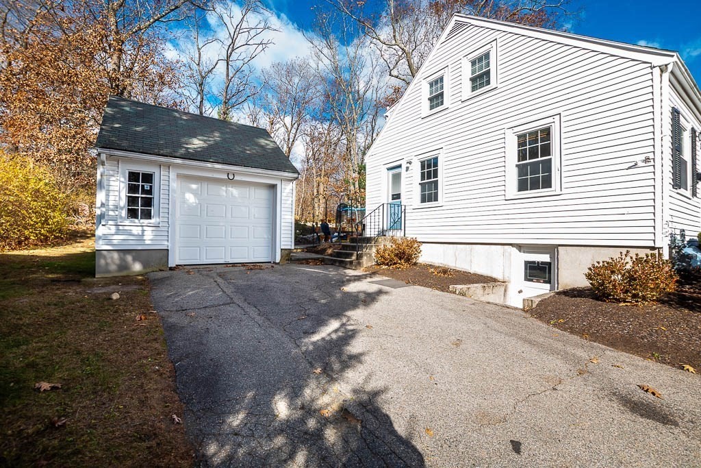 61 Ledgewood Road Dedham, MA 02026 - Photo 37 of 41 a front view of a house with a yard