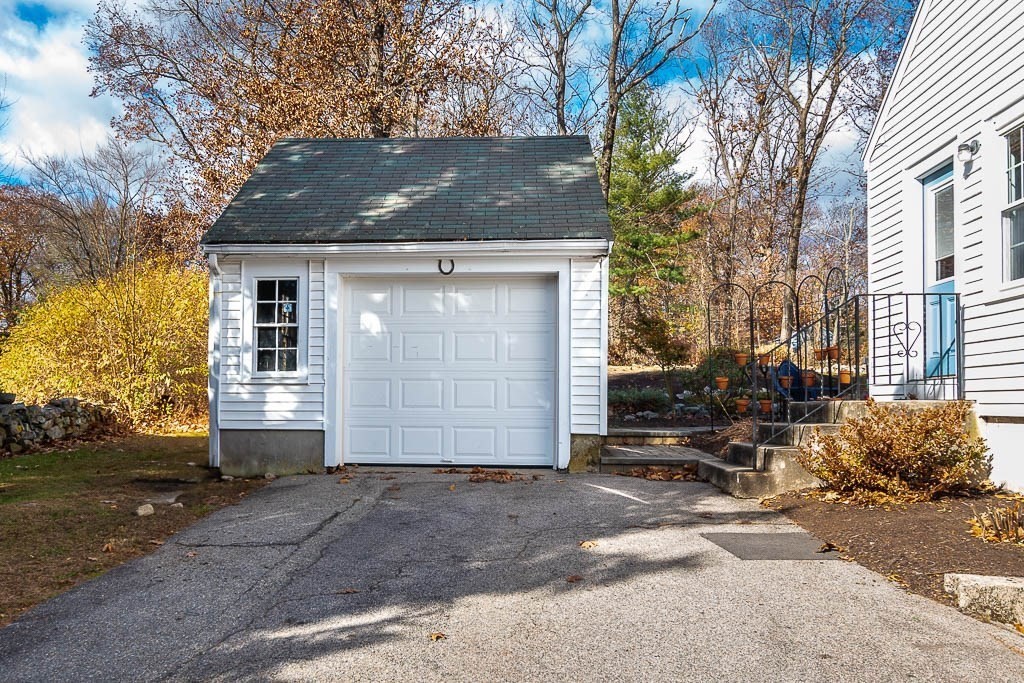 61 Ledgewood Road Dedham, MA 02026 - Photo 38 of 41 a front view of a house with a garage