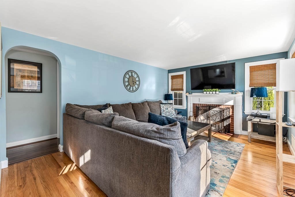61 Ledgewood Road Dedham, MA 02026 - Photo 5 of 41 a living room with furniture and a flat screen tv