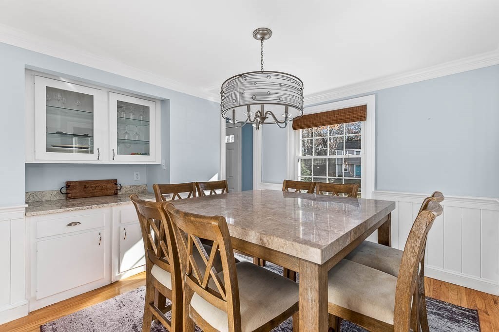 61 Ledgewood Road Dedham, MA 02026 - Photo 9 of 41 a view of a dining room with furniture window and wooden floor