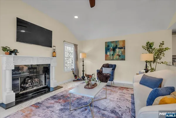a bedroom with bed and flat screen tv