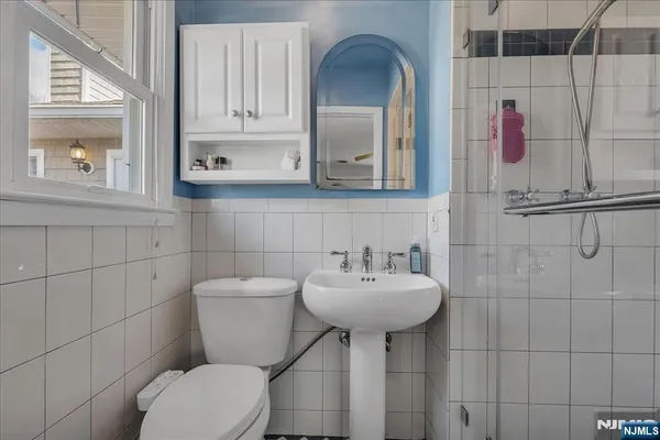 a view of balcony with table and chairs