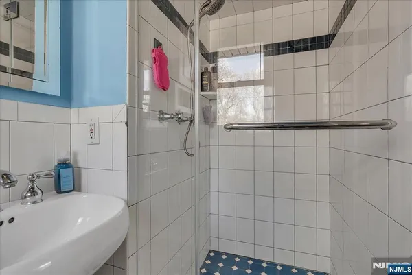 a view of a house with swimming pool and sitting area