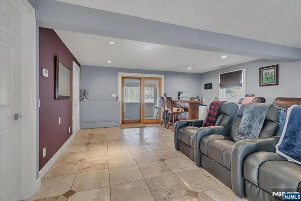 a view of a chair and tables in the balcony