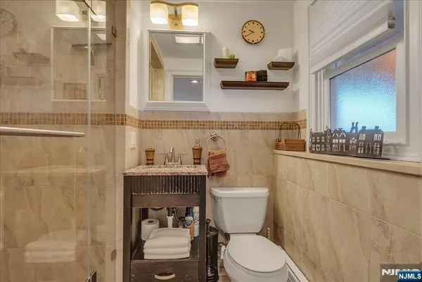 a view of a field with trees in the background