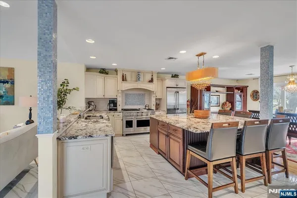 a white stove top oven sitting inside of a kitchen
