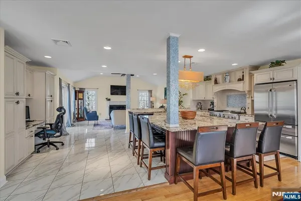 a dining room with furniture a rug and wooden floor