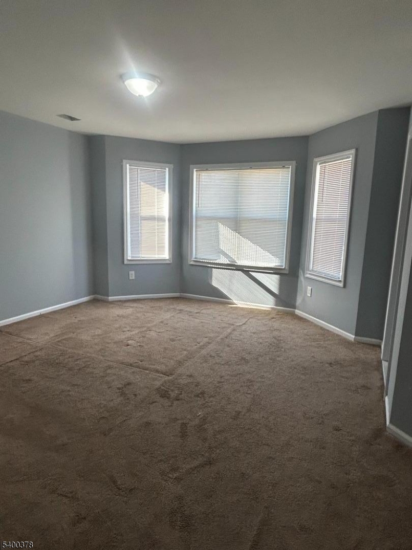 392 South 8th Street, Unit 2 Newark, NJ 07103 - Photo 4 of 6 a view of an empty room with a window