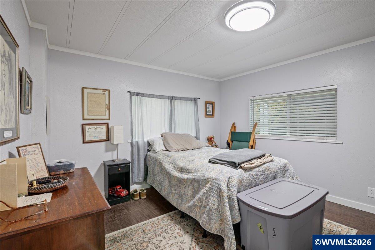 5422 Portland Road Northeast, Unit 123 Salem, OR 97305 - Photo 19 of 23 a bed room with a bed and a couch