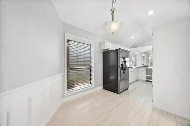 a kitchen with stainless steel appliances kitchen island a refrigerator and a sink