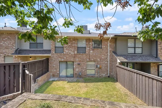 a view of a house with a tub and fire pit