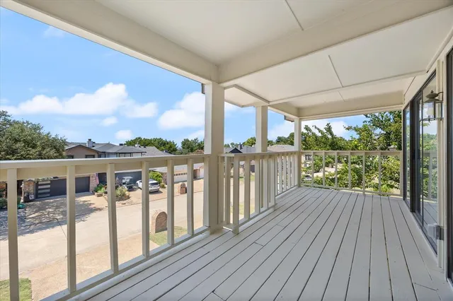 a view of balcony with wooden floor