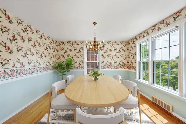 a bath tub sitting in a bathroom next to a window